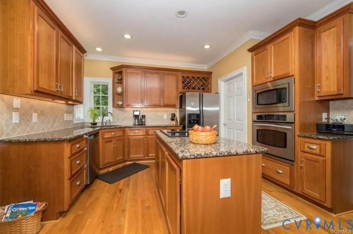 1638 Fallen Timber Trail Powhatan, VA 23139 - Photo 9 of 46 a kitchen with stainless steel appliances granite countertop a refrigerator a stove top oven and sink