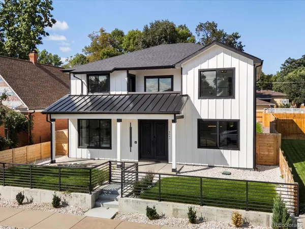 a front view of a house with garage