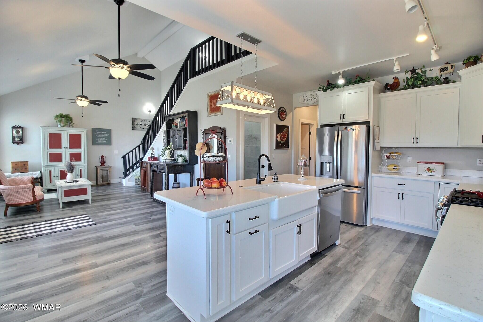 5325 Pinedale Wash Road Pinedale, AZ 85934 - Photo 10 of 32 a kitchen with sink cabinets and refrigerator