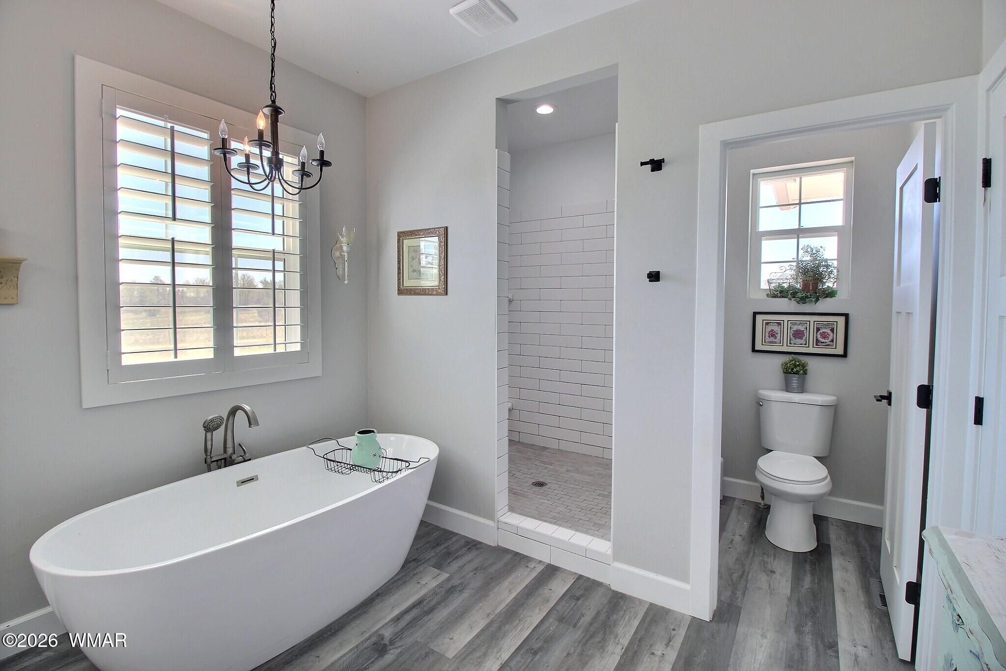 5325 Pinedale Wash Road Pinedale, AZ 85934 - Photo 14 of 32 a white bath tub sitting next to a white toilet