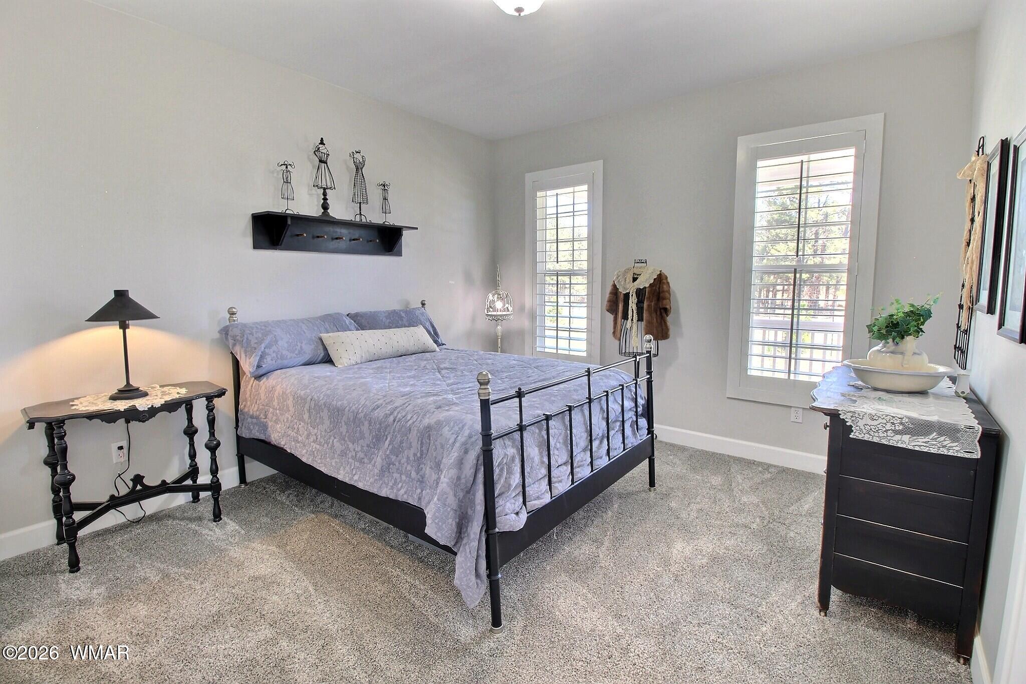 5325 Pinedale Wash Road Pinedale, AZ 85934 - Photo 15 of 32 a bedroom with a bed and a window