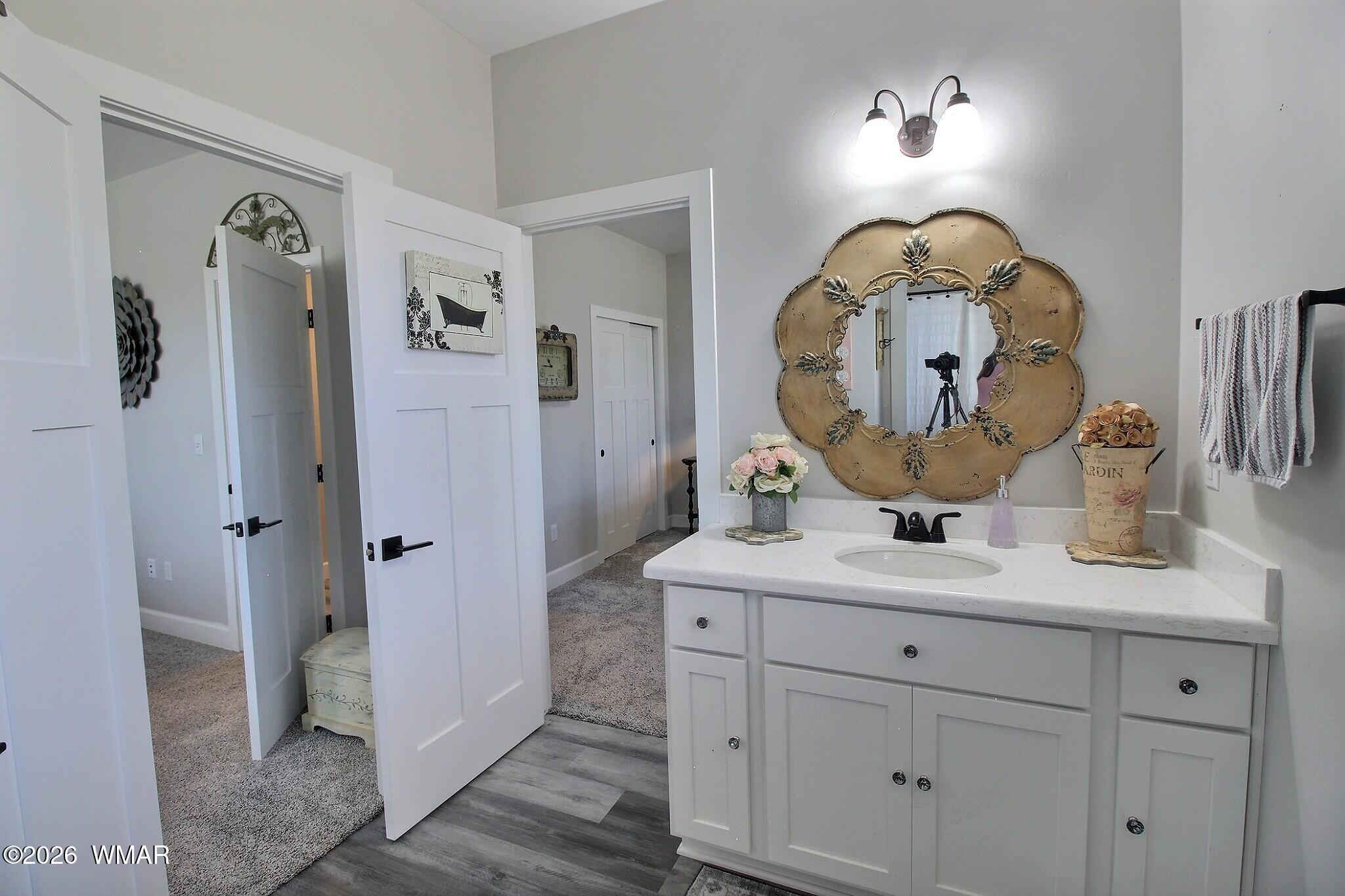 5325 Pinedale Wash Road Pinedale, AZ 85934 - Photo 16 of 32 a bathroom with a sink mirror and vanity
