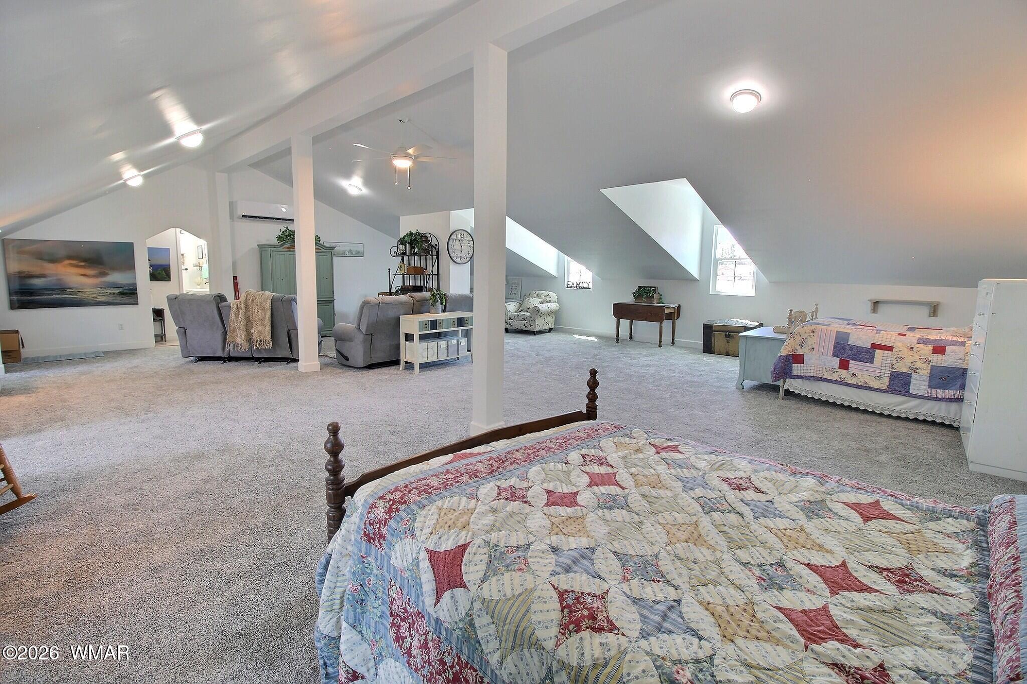5325 Pinedale Wash Road Pinedale, AZ 85934 - Photo 22 of 32 a large room with a bed and a view of kitchen