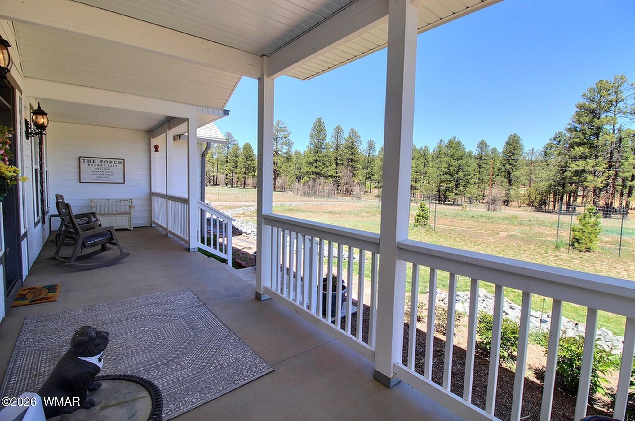 5325 Pinedale Wash Road Pinedale, AZ 85934 - Photo 2 of 32 a view of a porch with furniture