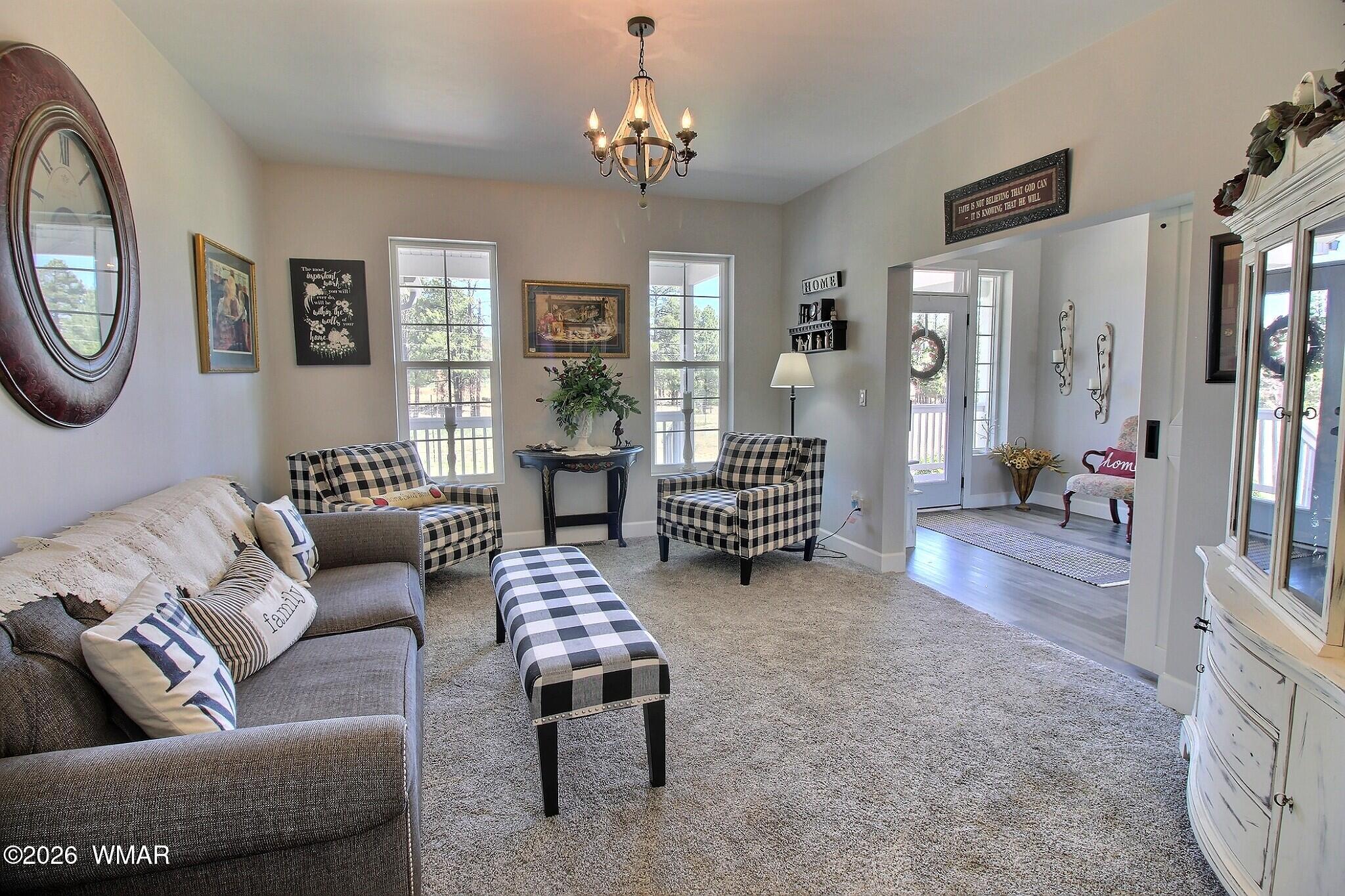 5325 Pinedale Wash Road Pinedale, AZ 85934 - Photo 5 of 32 a living room with furniture and a chandelier