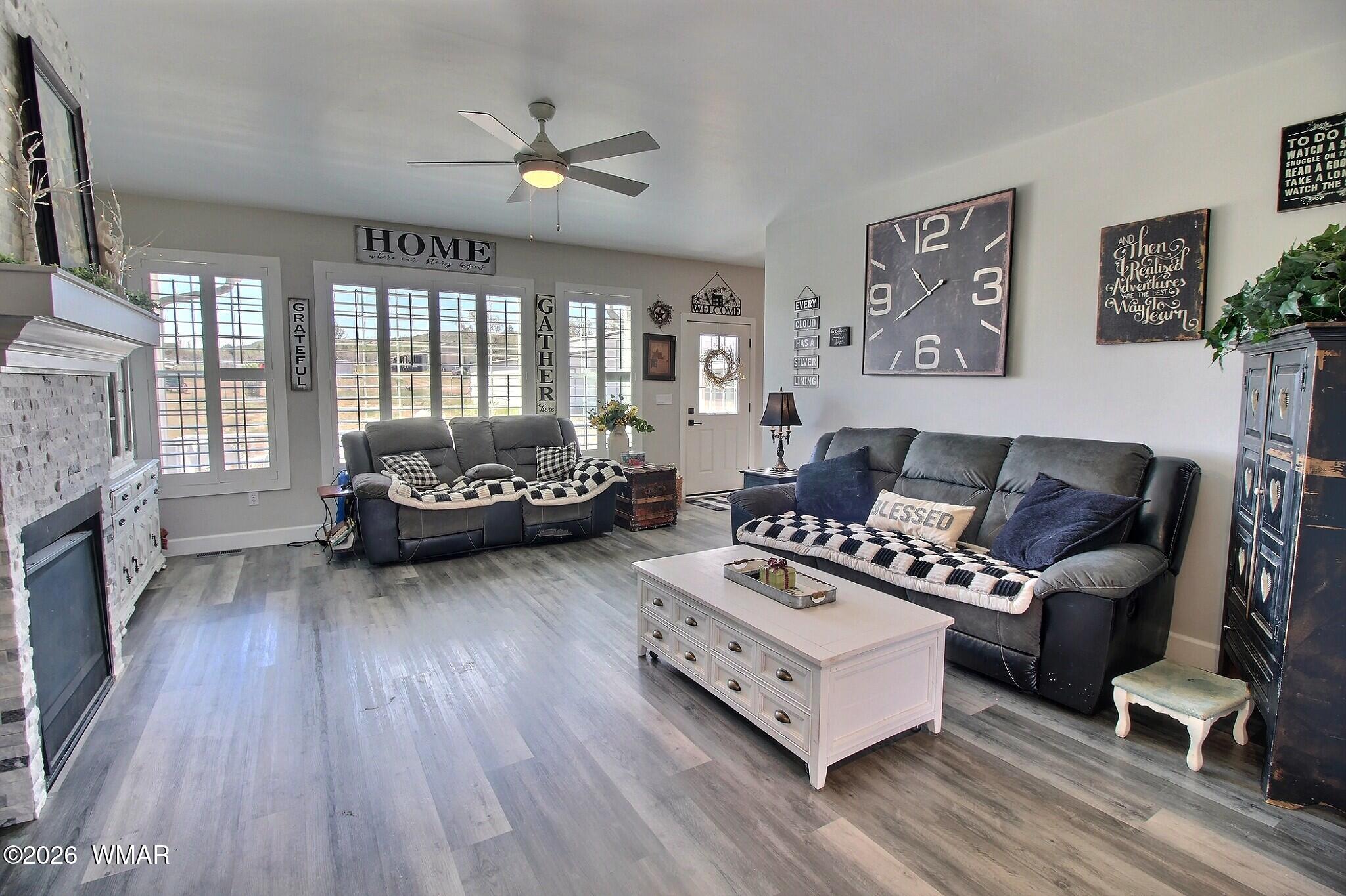 5325 Pinedale Wash Road Pinedale, AZ 85934 - Photo 6 of 32 a living room with furniture and a fireplace