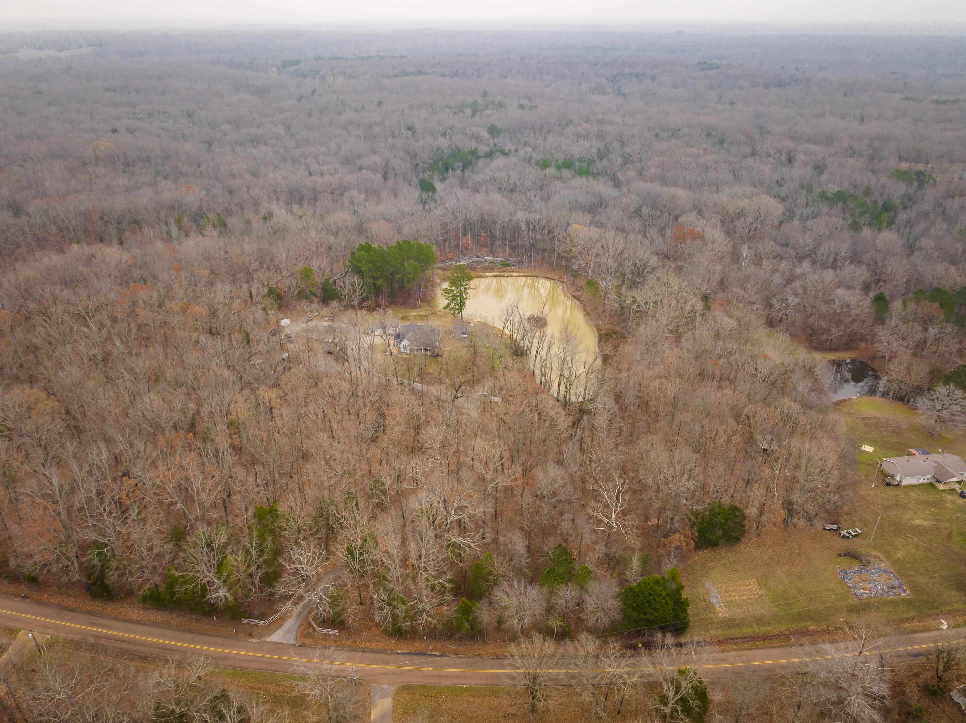 Aerial overview of property's location with a forest