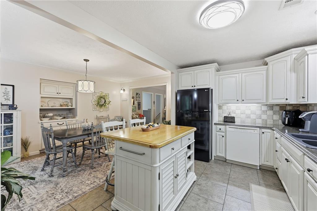 136 Ross Road Mineral Bluff, GA 30559 - Photo 15 of 65 a kitchen with sink cabinets and refrigerator