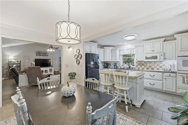 a bedroom with furniture and a chandelier