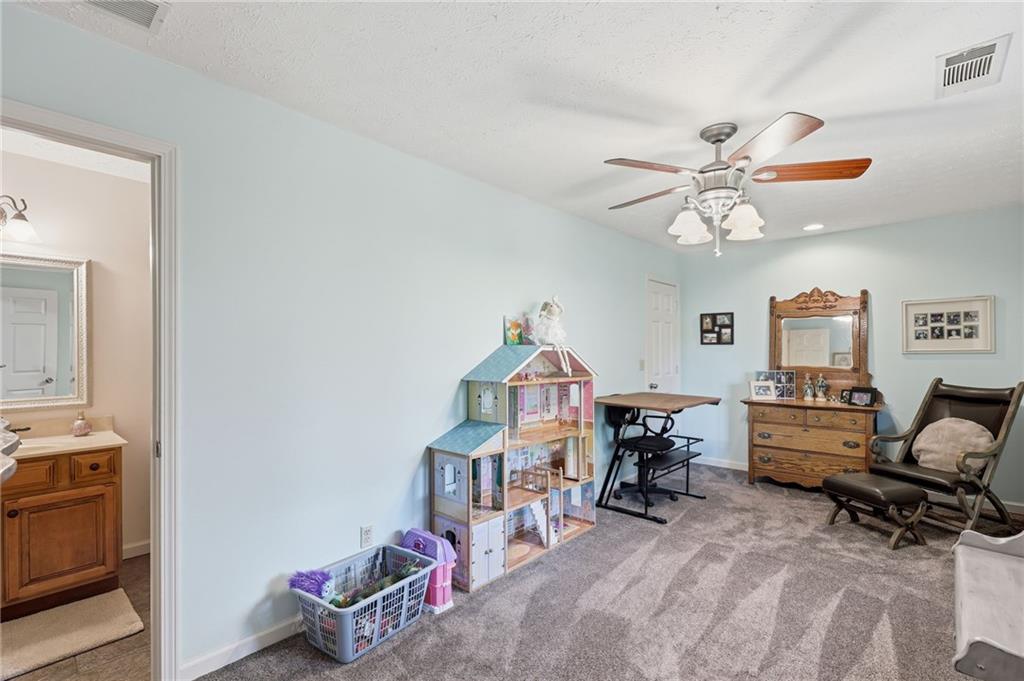 136 Ross Road Mineral Bluff, GA 30559 - Photo 23 of 65 a living room with furniture and a chandelier
