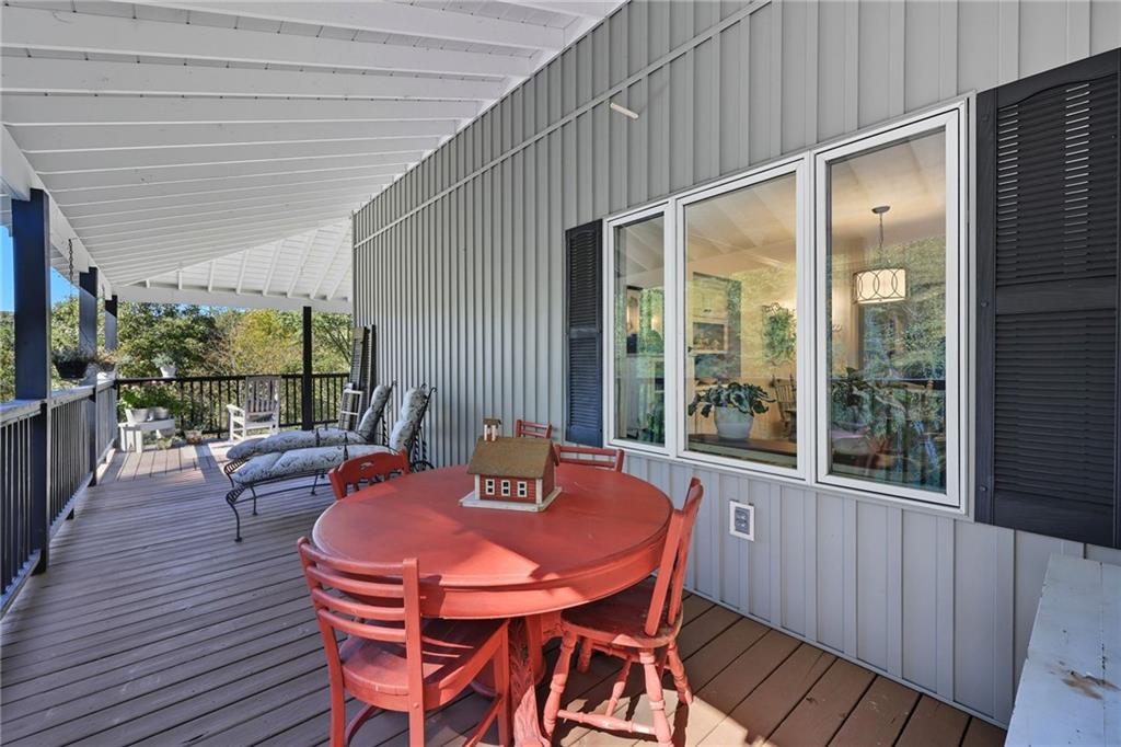 136 Ross Road Mineral Bluff, GA 30559 - Photo 29 of 68 a outdoor dining space with furniture and wooden floor