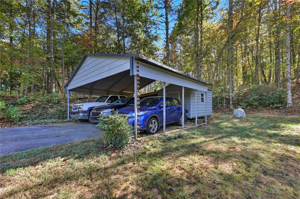 136 Ross Road Mineral Bluff, GA 30559 - Photo 32 of 65 a view of a house with a yard