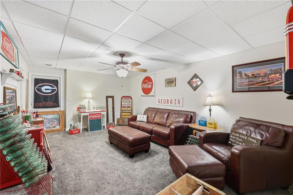 136 Ross Road Mineral Bluff, GA 30559 - Photo 36 of 65 a living room with furniture and a flat screen tv