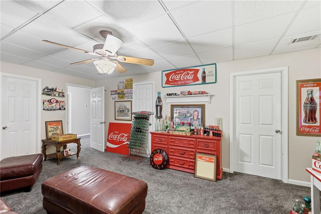 136 Ross Road Mineral Bluff, GA 30559 - Photo 37 of 65 a living room with furniture and a chandelier