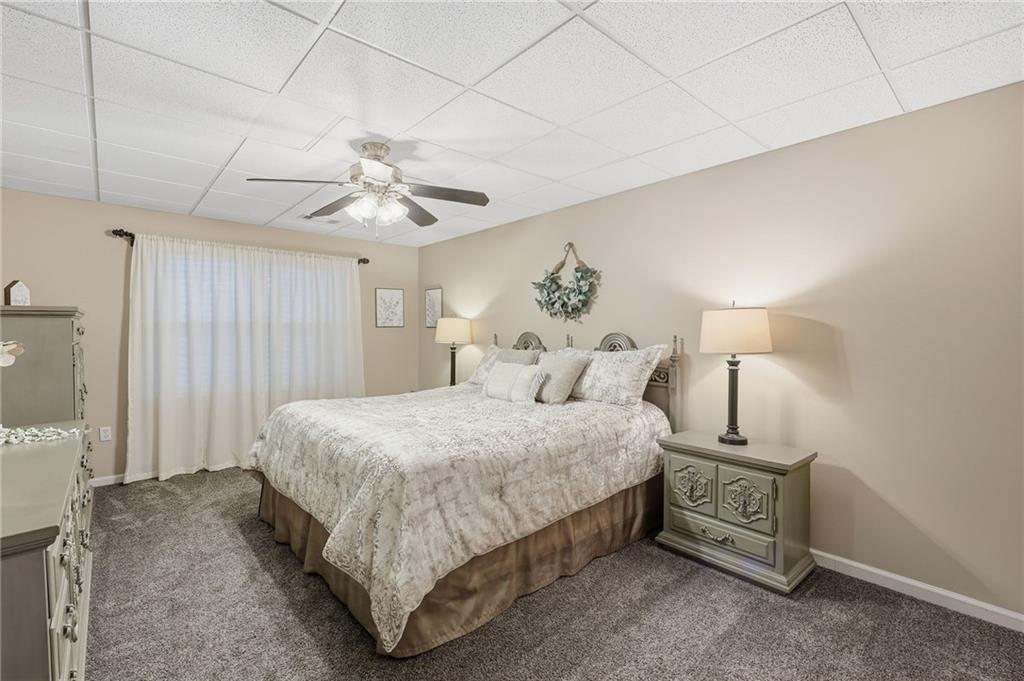 136 Ross Road Mineral Bluff, GA 30559 - Photo 38 of 65 a bedroom with a bed and a chandelier