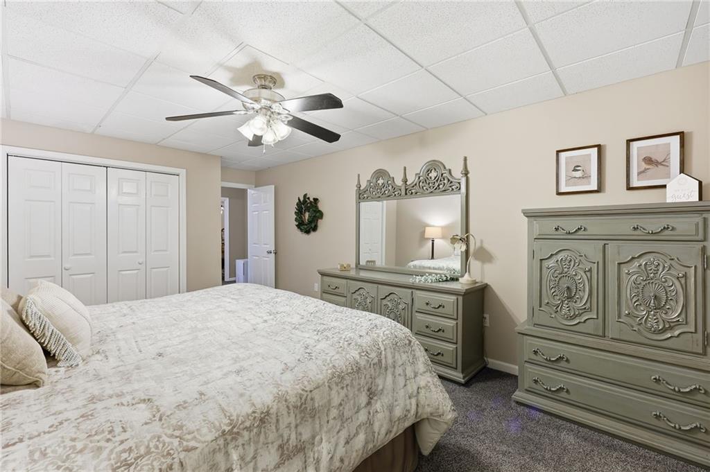 136 Ross Road Mineral Bluff, GA 30559 - Photo 39 of 65 a bedroom with a bed and a chandelier