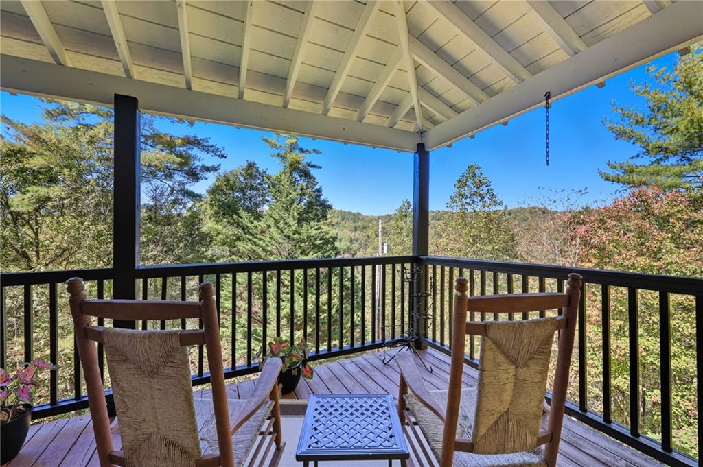 136 Ross Road Mineral Bluff, GA 30559 - Photo 4 of 65 a view of a two chairs in the balcony