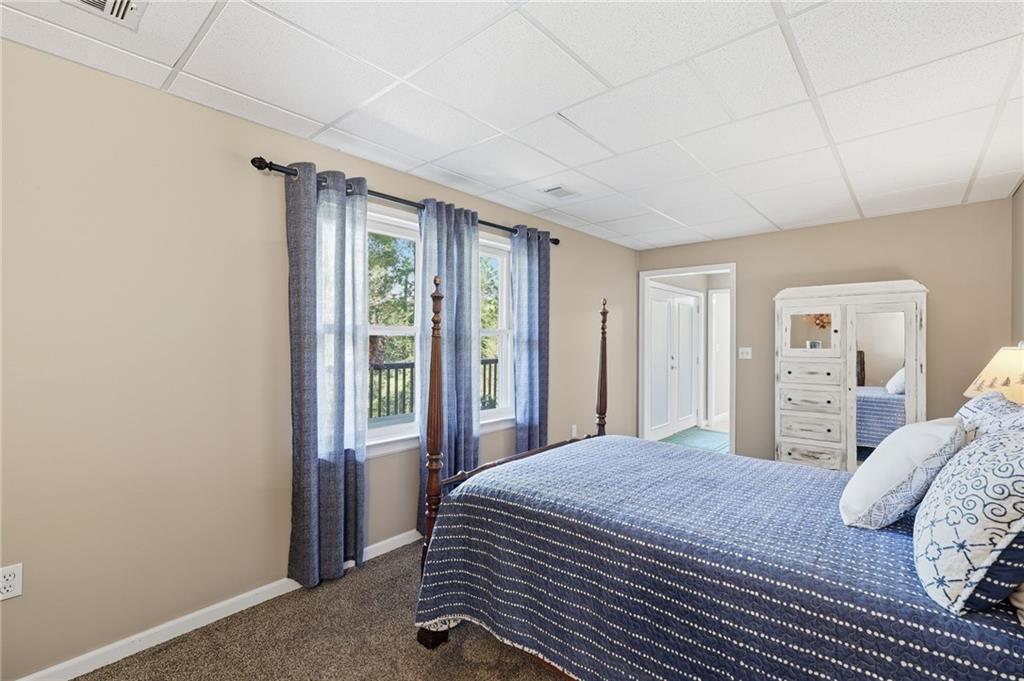 136 Ross Road Mineral Bluff, GA 30559 - Photo 42 of 65 a bedroom with a large bed and a window