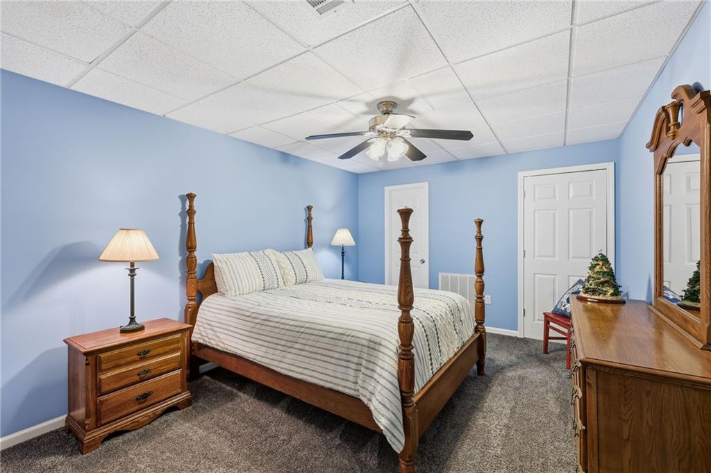 136 Ross Road Mineral Bluff, GA 30559 - Photo 43 of 65 a bedroom with a bed chandelier and a window