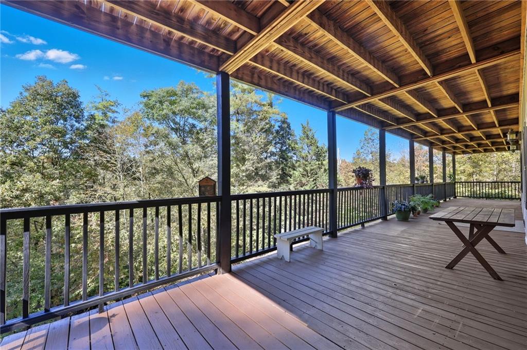136 Ross Road Mineral Bluff, GA 30559 - Photo 49 of 65 a view of a balcony with wooden floor