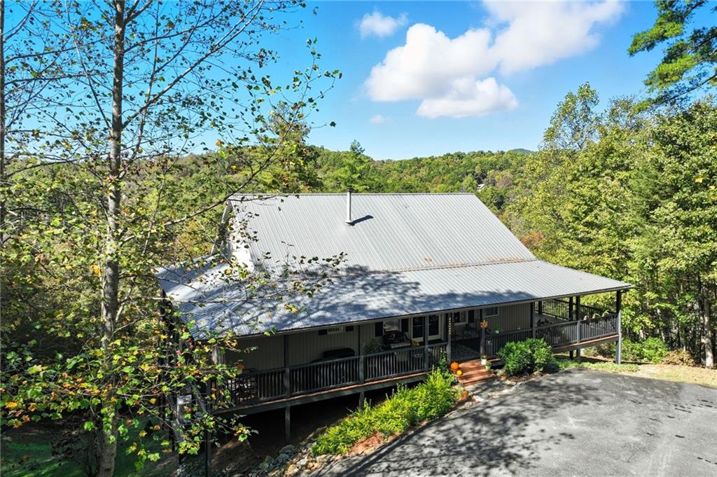 136 Ross Road Mineral Bluff, GA 30559 - Photo 64 of 65 a view of a house with a yard and potted plants