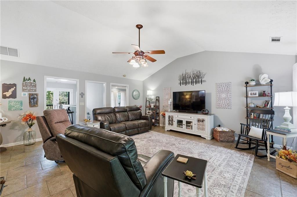 136 Ross Road Mineral Bluff, GA 30559 - Photo 9 of 65 a living room with furniture and a flat screen tv