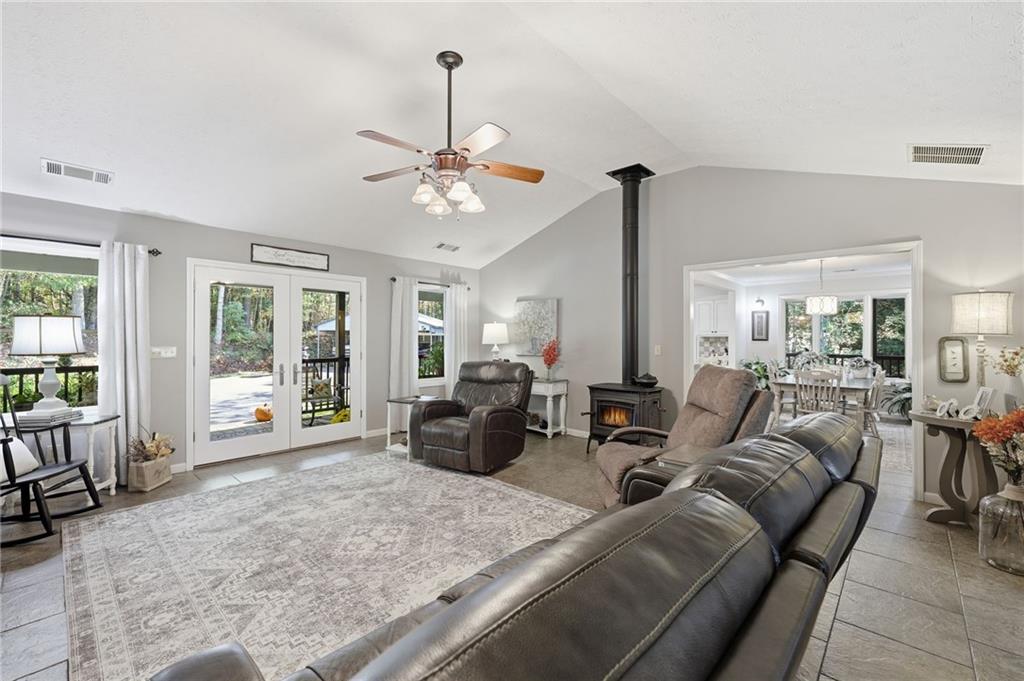 136 Ross Road Mineral Bluff, GA 30559 - Photo 10 of 65 a living room with furniture chandelier and large windows