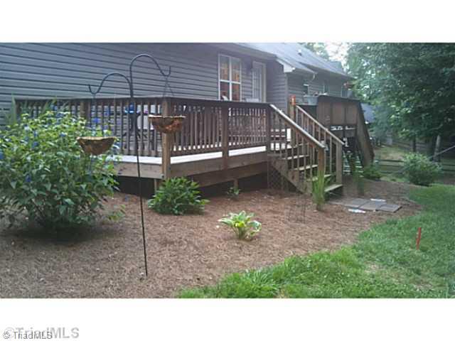 7507 Keating Drive Oak Ridge, NC 27310 - Photo 2 of 16 Exterior Back.