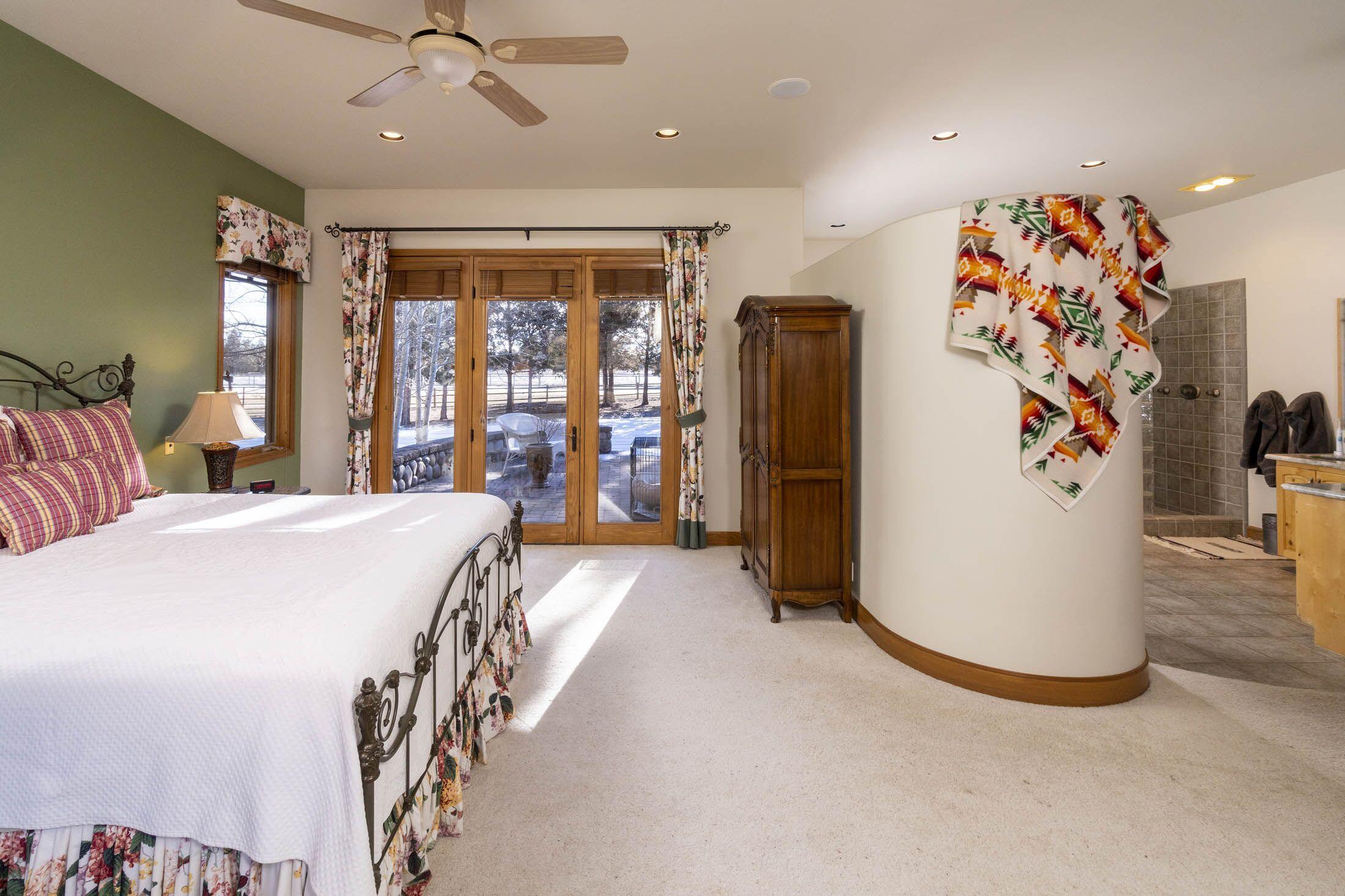 65520 Gerking Market Road Bend, OR 97703 - Photo 13 of 49 Master Suite has windows on three sides and his-and-her walk-in closets.
