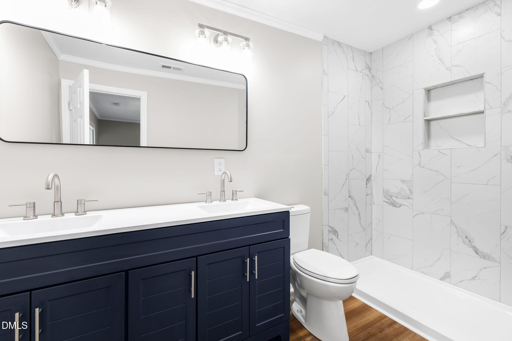 426 Rooker Dairy Road Norlina, NC 27563 - Photo 14 of 33 a bathroom with a sink a toilet and shower