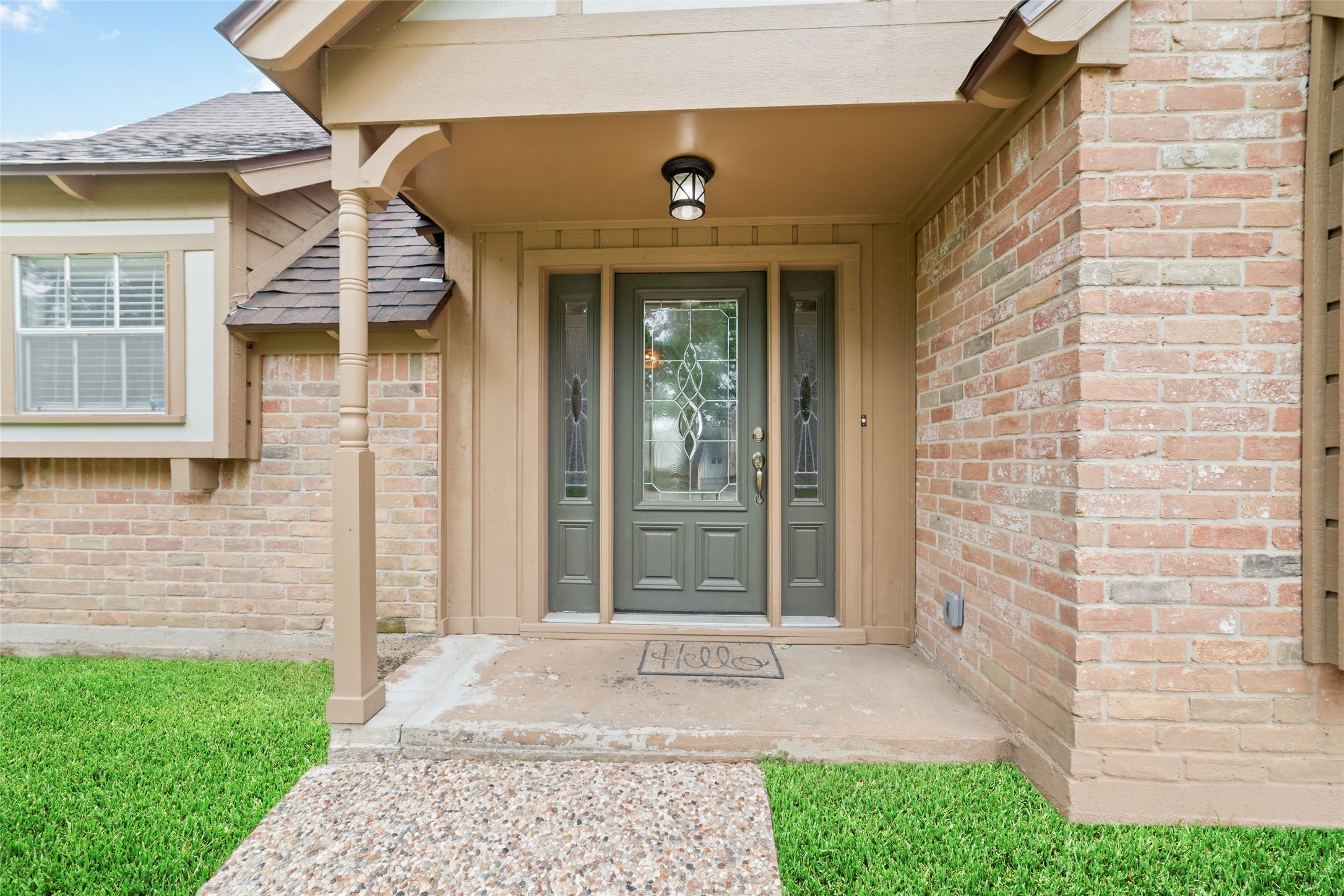 7910 Oak Moss Drive Spring, TX 77379 - Photo 2 of 38 Nice, welcoming front porch with a grassy door entrance.