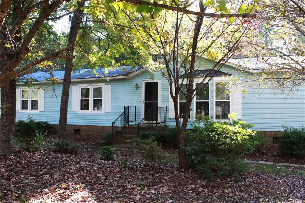 1262 Stateline Road Lake Wylie, SC 29710 - Photo 1 of 20 a house view with a garden space