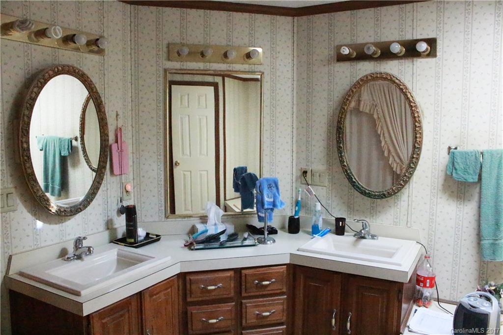 1262 Stateline Road Lake Wylie, SC 29710 - Photo 15 of 20 a bathroom with a double vanity sink and a mirror