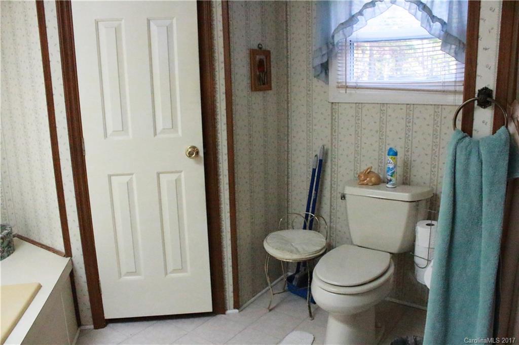 1262 Stateline Road Lake Wylie, SC 29710 - Photo 16 of 20 a white toilet sitting next to a bathroom sink