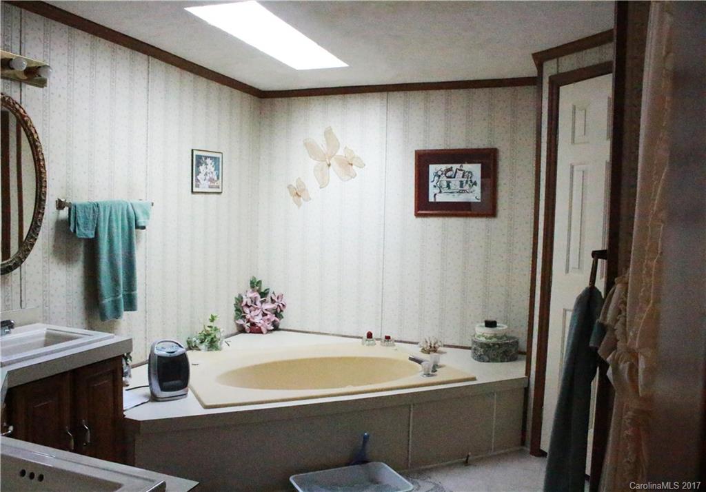 1262 Stateline Road Lake Wylie, SC 29710 - Photo 17 of 20 a bathroom with a double vanity sink mirror and bathtub