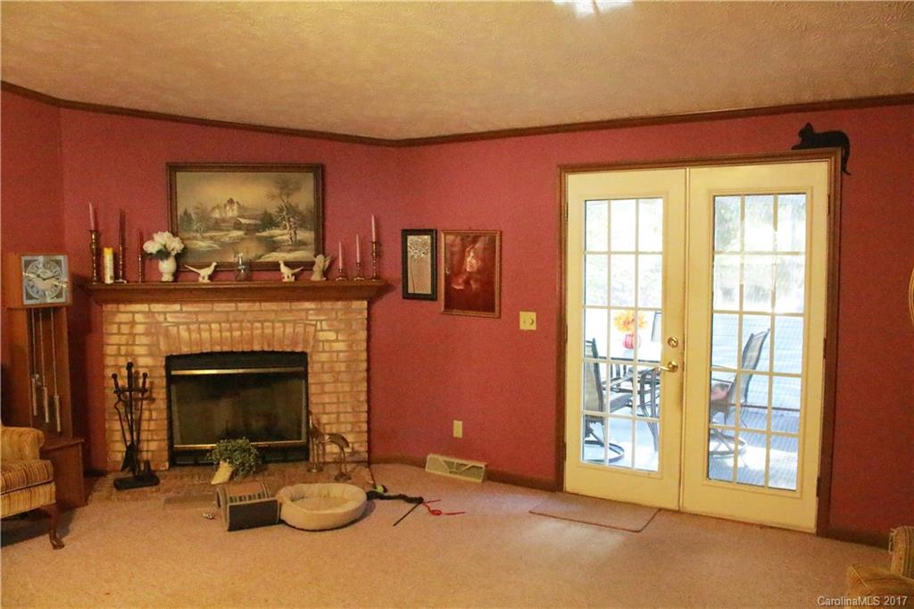1262 Stateline Road Lake Wylie, SC 29710 - Photo 9 of 20 a living room with furniture a fireplace and a flat screen tv