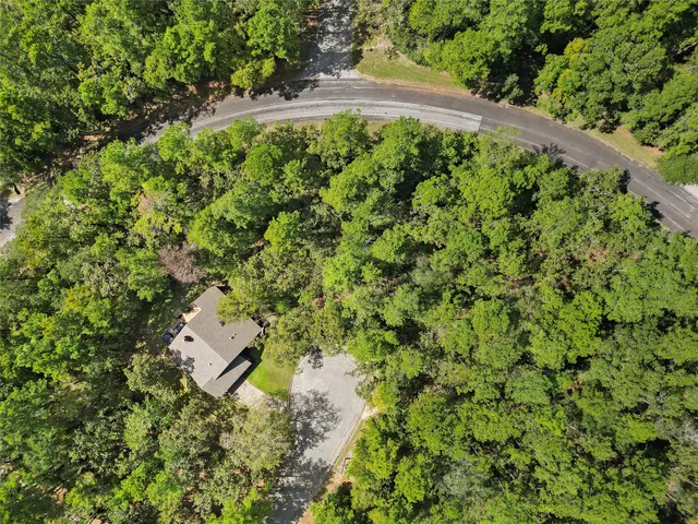 a backyard of a house with a yard and outdoor seating