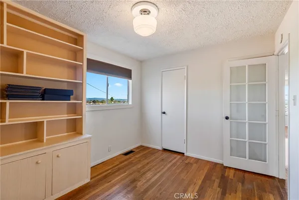 a room with walk in closet and a window