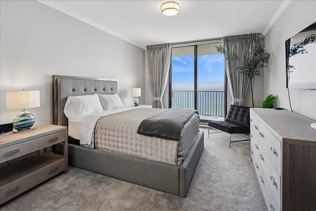 a bedroom with a bed and a couch