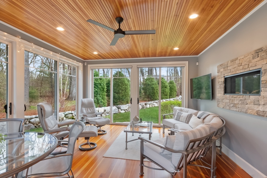 27 Maxwell Road Bedford, MA 01730 - Photo 13 of 41 a living room with furniture and a flat screen tv
