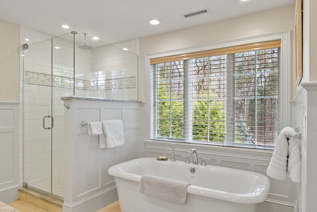 27 Maxwell Road Bedford, MA 01730 - Photo 16 of 41 a bathroom with a bathtub and a shower