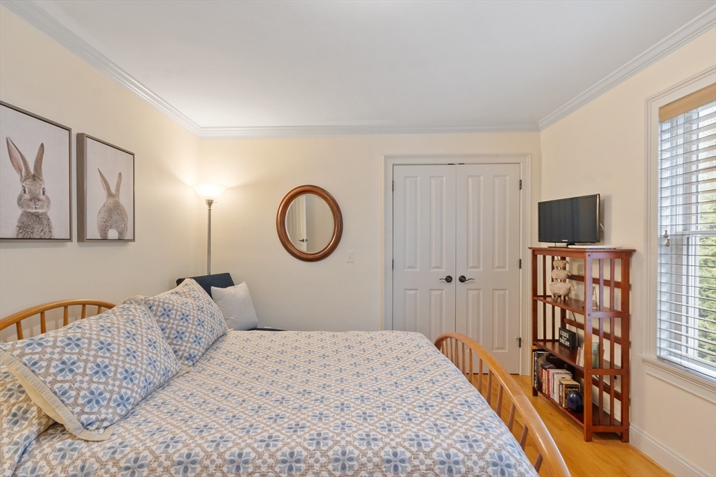 27 Maxwell Road Bedford, MA 01730 - Photo 19 of 41 a bedroom with a bed and a window