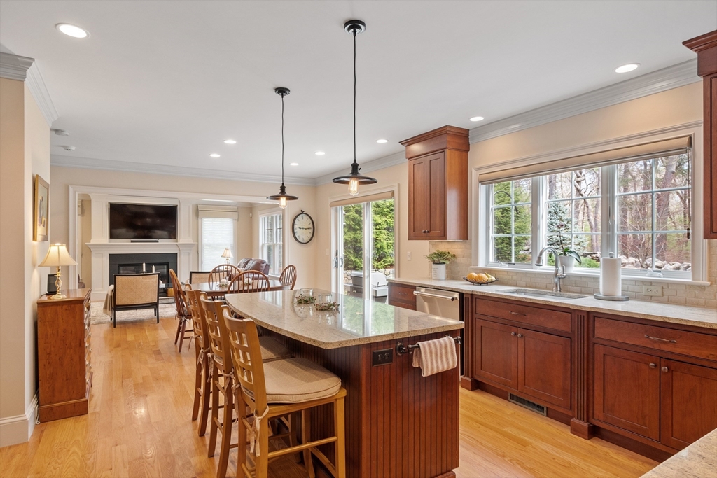 27 Maxwell Road Bedford, MA 01730 - Photo 2 of 41 a large kitchen with lots of counter space and dining table