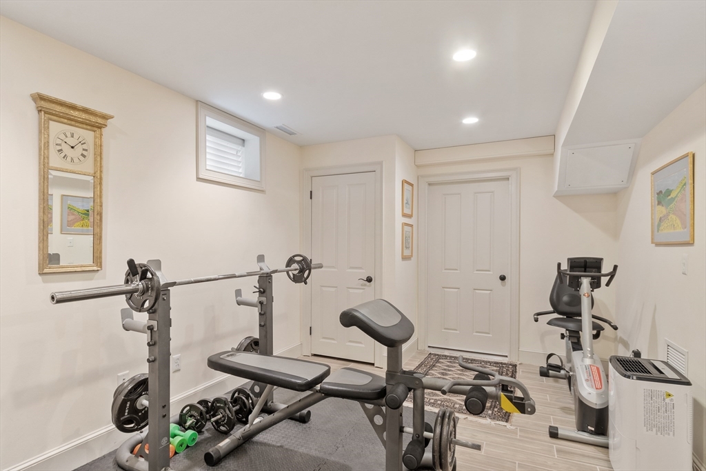 27 Maxwell Road Bedford, MA 01730 - Photo 24 of 41 a bathroom with a sink and a mirror