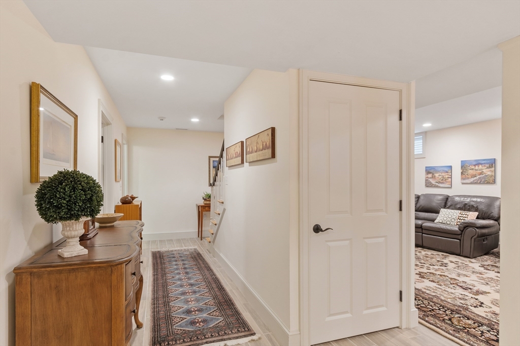 27 Maxwell Road Bedford, MA 01730 - Photo 25 of 41 a view of hallway with livingroom and furniture
