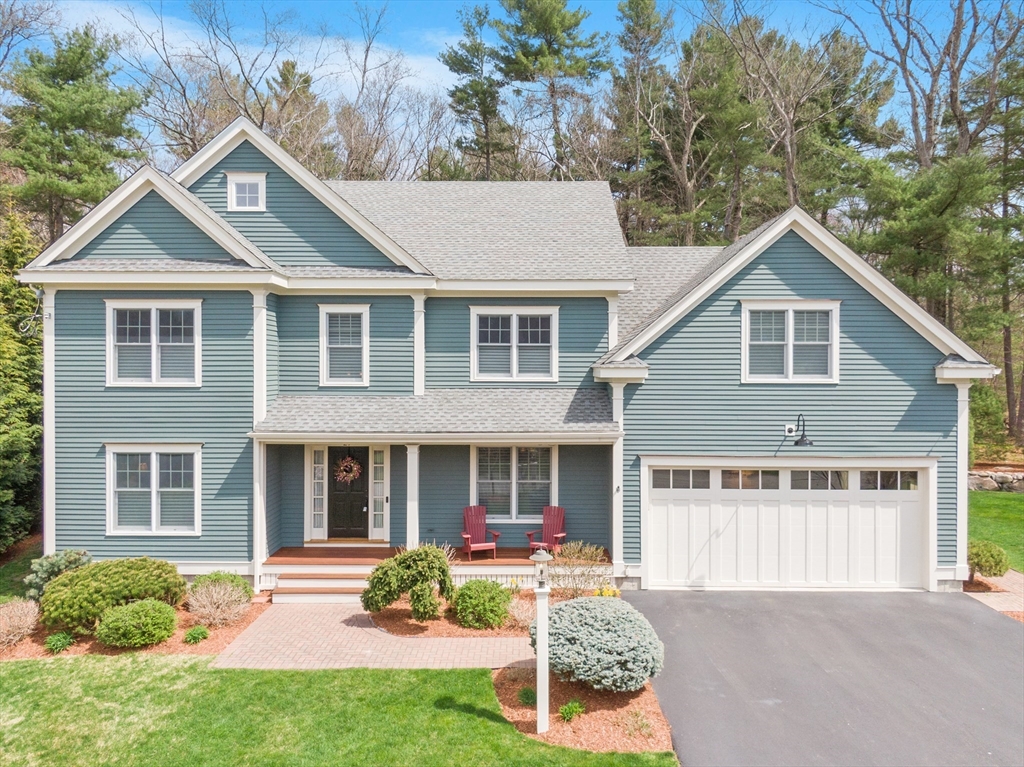 27 Maxwell Road Bedford, MA 01730 - Photo 26 of 41 a front view of a house with a yard and porch