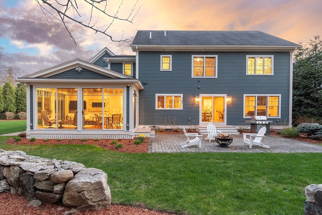 27 Maxwell Road Bedford, MA 01730 - Photo 35 of 41 a front view of a house with patio and garden