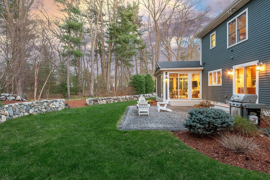 27 Maxwell Road Bedford, MA 01730 - Photo 36 of 41 a view of a chair and table in backyard of the house