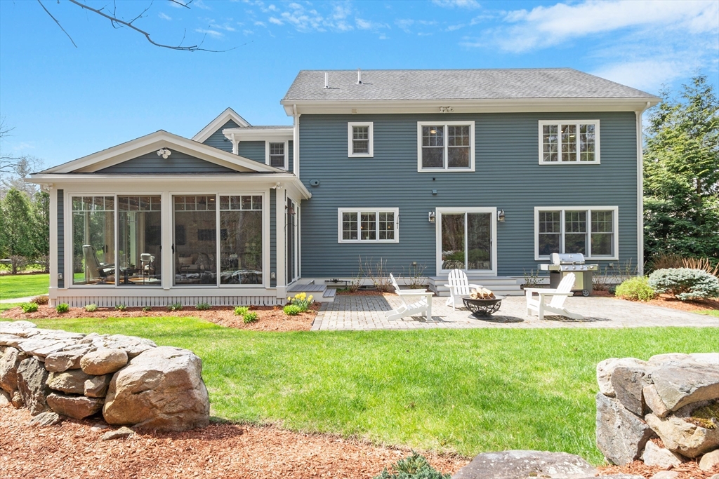27 Maxwell Road Bedford, MA 01730 - Photo 41 of 41 a front view of a house with garden and patio