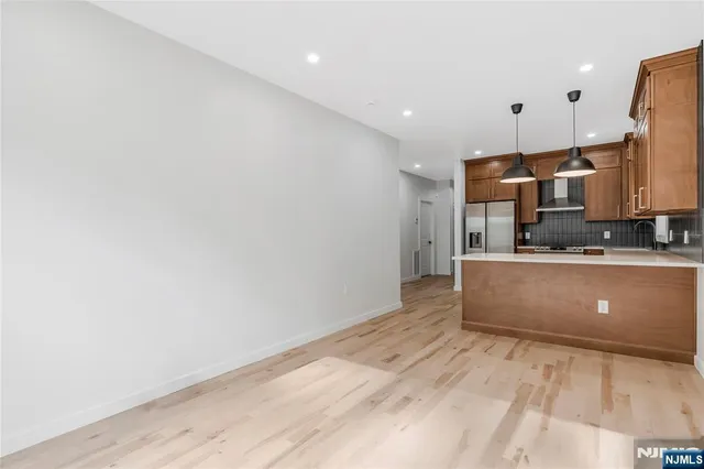 a view of kitchen with wooden floor